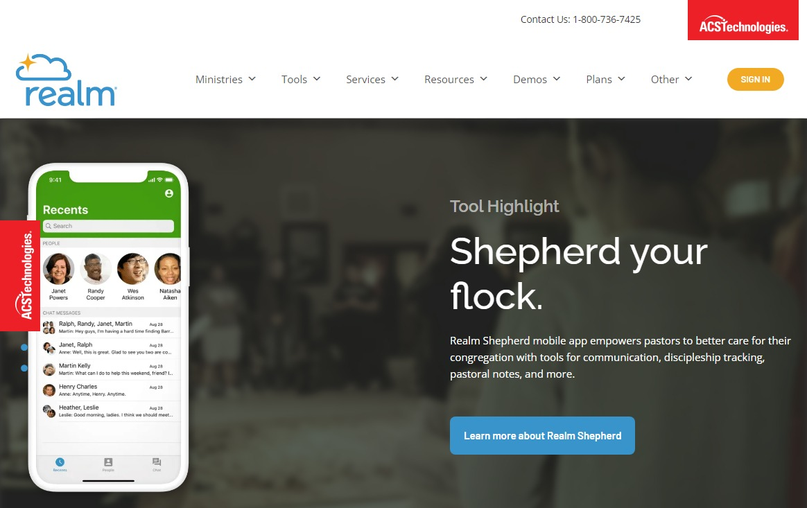 A group of people in a church discussing Realm's community focus